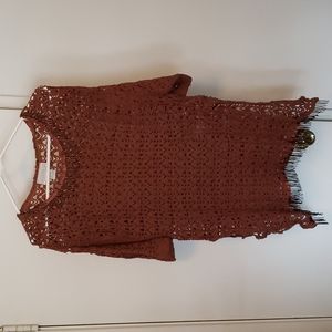 Brown crochet look swimsuit cover up with side slits.